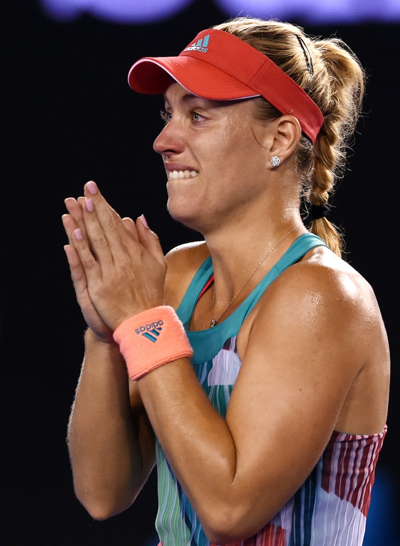 epa05134691 Angelique Kerber of Germany celebrates winning her final match against Serena Williams of the US at the Australian Open tennis tournament in Melbourne, Australia, 30 January 2016. EPA/FILIP SINGER