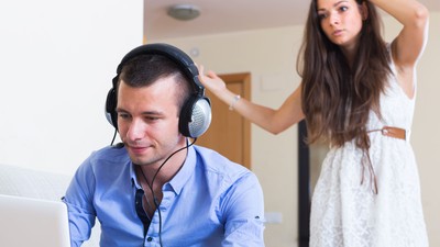 45500716 - upset young woman suspecting spouse spending money on games online