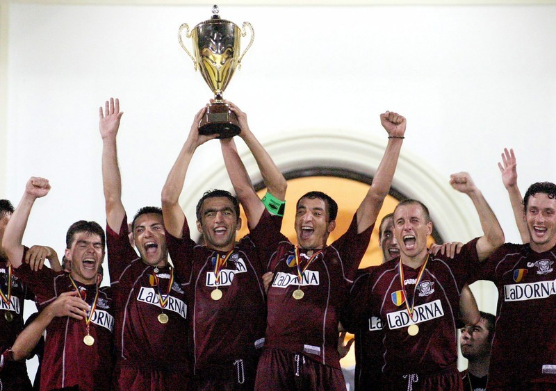 Rapid Bucharest's players celebrate after their captain Adrian Iencsi raises the Supercup trophy which they wo with a "golden goal" against Dinamo Bucharest during the Romania's Supercup soccer final in Bucharest, Saturday 02 August 2003. Rapid won 1-0 in front of Dinamo. In the 2002 - 2003 season Rapid also won the Romaian Soccer Championship. EPA PHOTO/EPA/ROBERT GHEMENT