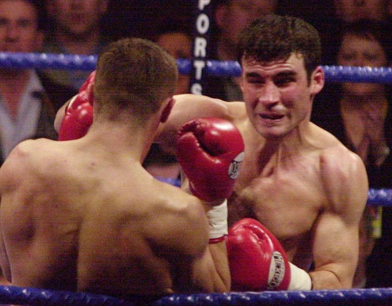 FFM918-20010428-CARDIFF, UNITED KINGDOM: Joe Calzaghe, the WBO Super Middleweight World champion from Wales (R) brings in a right handed punch to knock down his challenger, Germany's Mario Veit at the Cardiff International Arena, 28 April 2001. EPA PHOTO EPA/Martyn HAYHOW