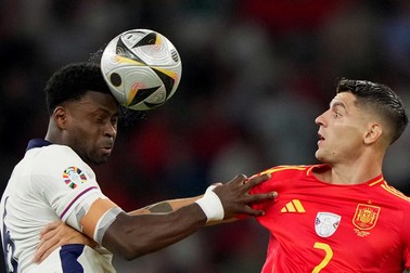 England's Marc Guehi .fight for the ball with Spain's Alvaro Morata during the Euro 2024 soccer match between Spain and England at the Olympiastadion, Berlin , Germany - Sunday , July 14 , 2024. Sport - Soccer . Spain vs England - UEFA Euro 2024 Germany, Berlin - 14 Jul 2024,Image: 889710784, License: Rights-managed, Restrictions: , Model Release: no