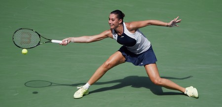 epa04922455 Flavia Pennetta of Italy hits a return to Petra Kvitova of the Czech Republic during their quarterfinals match on the tenth day of the 2015 US Open Tennis Championship at the USTA National Tennis Center in Flushing Meadows, New York, USA, 09 September 2015. The US Open runs through 13 September, which is a return to a 14-day schedule. EPA/JOHN G. MABANGLO