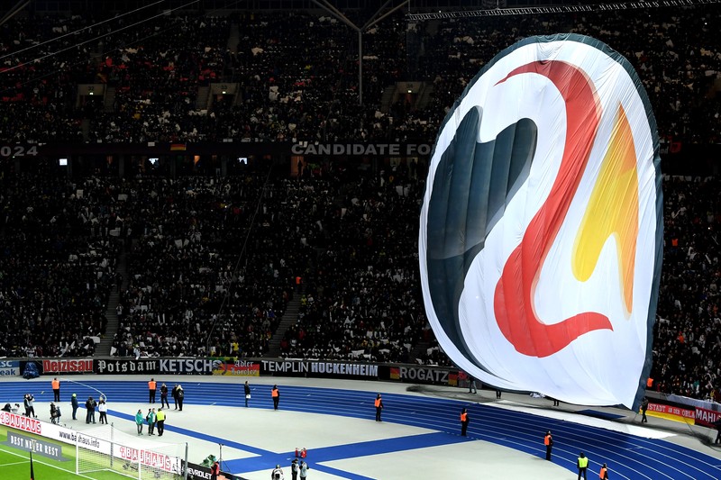 epa06632753 A banner with the logo of Germany's candidacy for the UEFA Euro 2024 tournament is seen prior to an international friendly soccer match between Germany and Brazil at the Olympic stadium in Berlin, Germany, 27 March 2018. EPA-EFE/CLEMENS BILAN