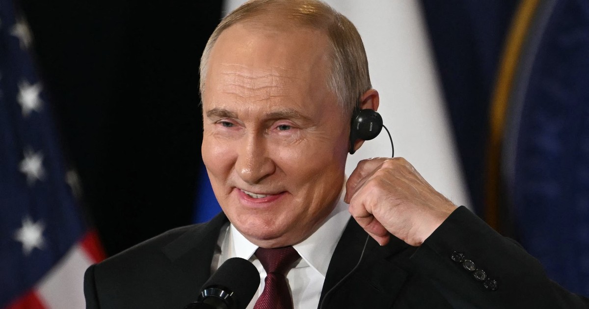 Imagine cu Vladimir Putin la o conferință de presă cu Donald Trump, în august. Liderul de la Kremlin a fost surprins zâmbind
