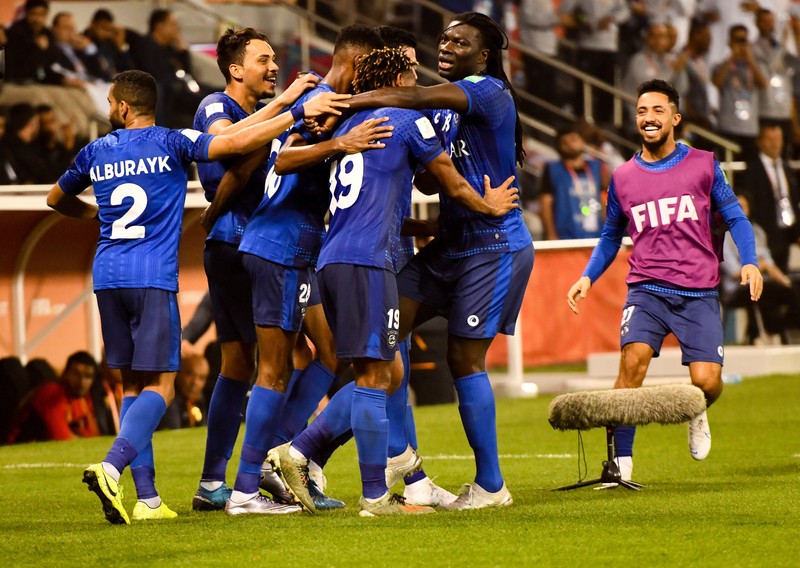epa08071597 Bafetimbi Gomis (2-R) of Al Hilal FC celebrates with teammates after scoring during the FIFA Club World Cup Qatar 2019 second round soccer match between Saudi Arabia's Al Hilal FC and Esperance Sportive de Tunis at the Jassim bin Hamad Stadium in Doha Qatar, 14 December 2019. EPA-EFE/NOUSHAD THEKKAYIL