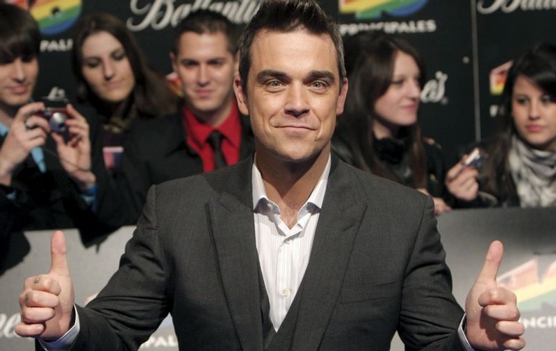 I s-a trezit instinctul patern: Robbie Williams vrea să adopte doi copii din Haiti