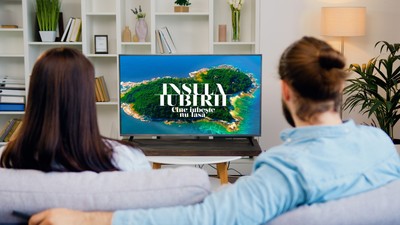 Happy,Couple,Watching,Tv,And,Switching,Channels,Looking,At,Green