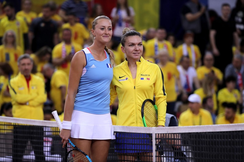 epa07517408  Simona Halep of Romania (R) and Kristina Mladenovic of France (L) pose prior to their game during the Fed Cup World Group, Semi Final between France and Romania, in Rouen, France, 20 April 2019 EPA-EFE/CHRISTOPHE PETIT TESSON