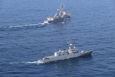 STYLELOCATIONA U.S. Navy Arleigh Burke-class guided-missile destroyer USS James E. Williams, top, conducts a passing exercise with the Colombian naval frigate ARC Antioquia during joint operations February 15, 2021 in the Caribbean Sea. (Credit Image: © Mc3 Kyle Moore/U.S. Navy/Planet Pix via ZUMA Wire)