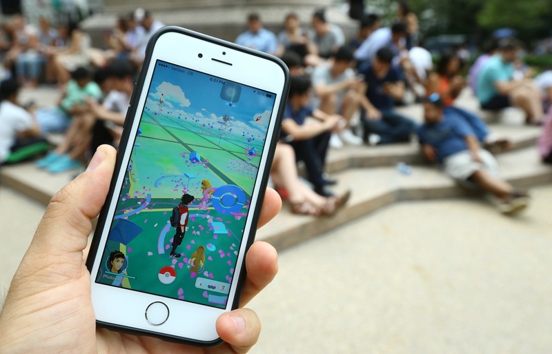 NEW YORK, NY - JULY 13: A Pokemon Go user plays Pokemon GO game in New York City, NY on July 13, 2016. Pokemon Go is a free-to-play location-based augmented reality mobile game which allows players to capture, battle, and train virtual Pokemon who appear throughout the real world. Pokemon Go was rolled out to iPhone and Android smartphone users in the United States, Australia and New Zealand on July 6. Volkan Furuncu / Anadolu Agency