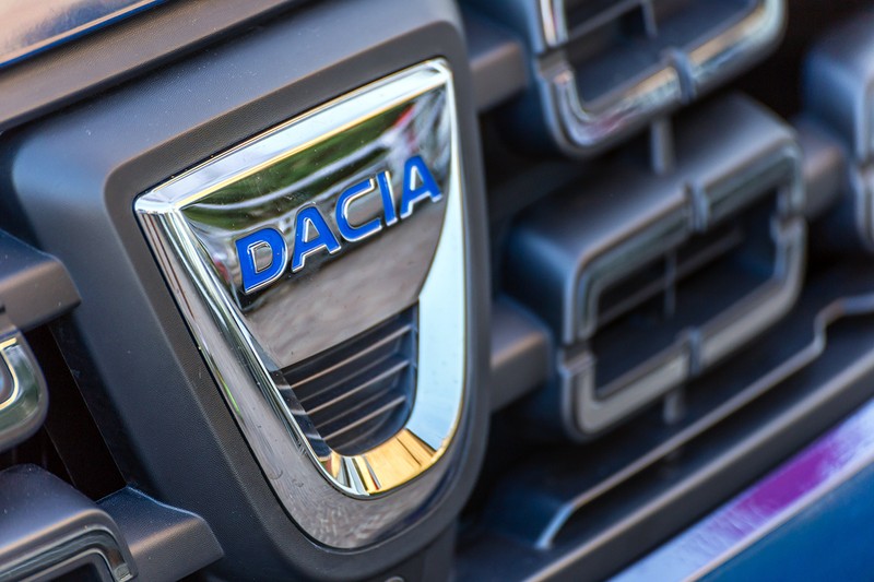 LUGO, ITALY - September 11, 2018: light enlightening DACIA logo on a car body