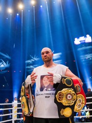 epa05046580 British fighter Tyson Fury celebrates in the ring after his victory over Ukraine's Vladimir Klitschko after their world heavyweight title bout at the Esprit Arena in Duesseldorf, Germany, 28 November 2015. Tyson Fury of Britain is the new heavyweight world champion after defeating long-reigning Ukrainian Vladimir Klitschko in a unanimous decision in Dusseldorf. Fury, 27, won the titles of the three most important ranking organizations, the IBF, WBO and WBA, in front of 45,000 spectators by a scores of 115-112, 115-112 and 116-111. EPA/Rolf Vennenbernd