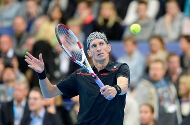 epa05018296 Jarkko Nieminen of Finland in action during the Jarkko Nieminen vs. Roger Federer Final Night Event at the Hartwall Arena in Helsinki, Finland, 09 November 2015. Finnish all time tennis ace Jarkko Nieminen faces Roger Federer in his career ending match. EPA/MARKKU OJALA ****