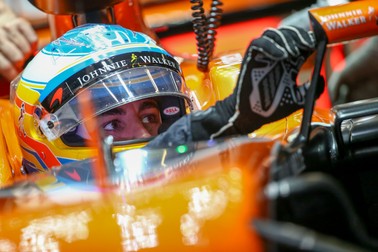 epa05894277 Spanish Formula One driver Fernando Alonso of McLaren-Honda adjusts his car's side mirror during the first practice session ahead of the Chinese Formula One Grand Prix at the Shanghai International circuit in Shanghai, China, 07 April 2017. The 2017 Chinese Formula One Grand Prix will take place on 09 April. EPA/DIEGO AZUBEL