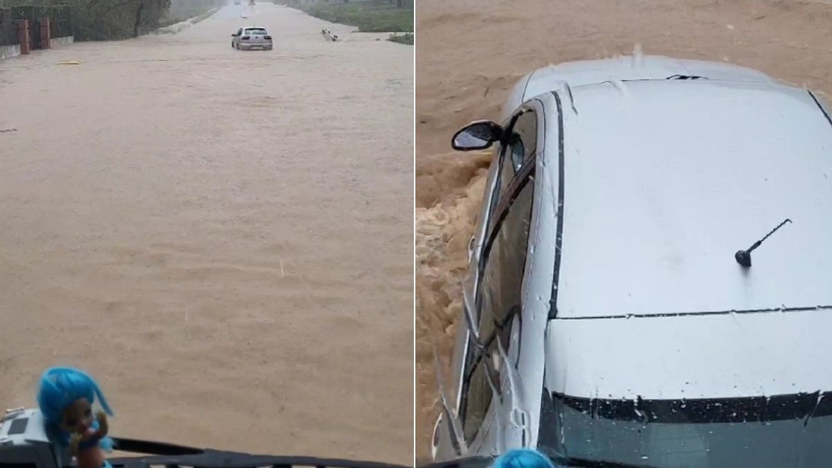 O mașină surprinsă de inundații este împinsă de un TIR condus de un șofer român, în timpul inundațiilor din Spania