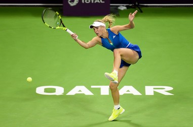epa05800816 Caroline Wozniacki of Denmark in action against Monica Puig of Puerto Rico during their semi final match at the WTA Qatar Ladies Open tennis tournament at the International Khalifa Tennis Complex in Doha, Qatar, 17 February 2017. EPA/NOUSHAD THEKKAYIL