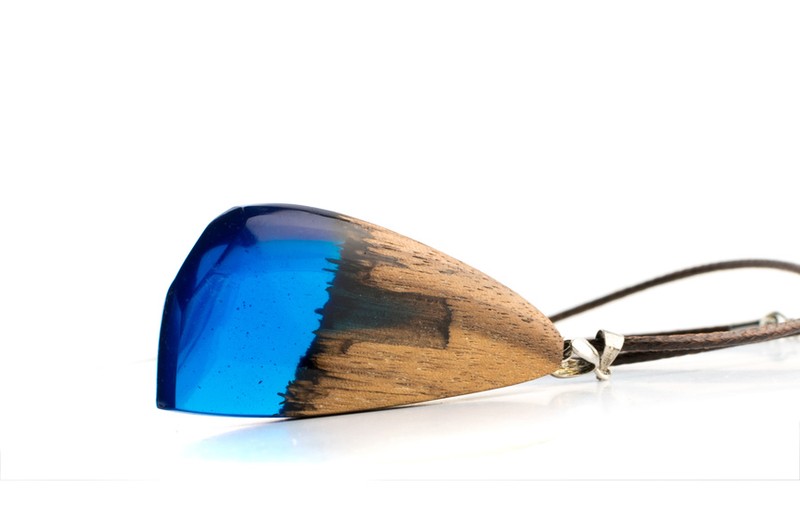 Pendant of Blue Color Isolated on White Background. Bijouterie Made of Epoxy Resin and Wood
