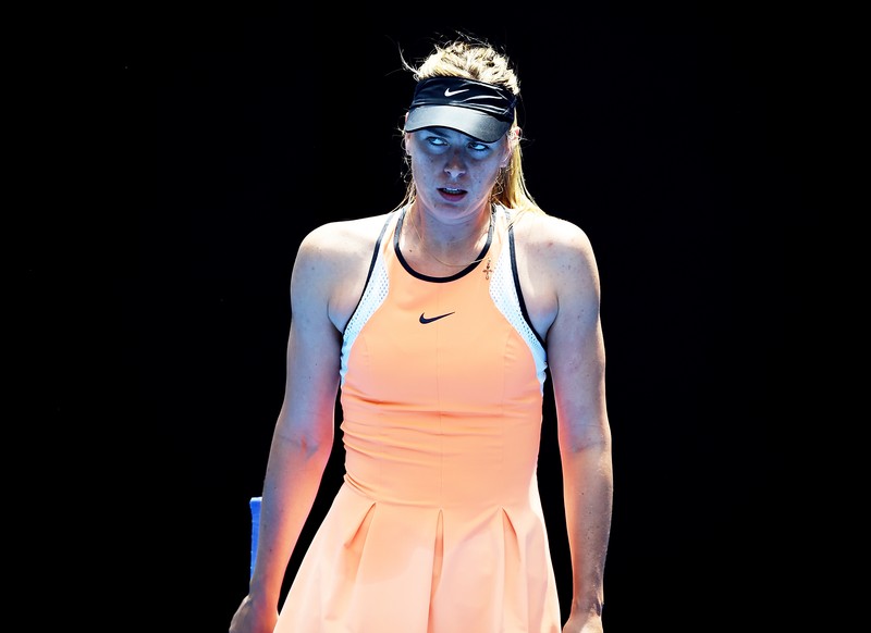 epa05126124 Maria Sharapova of Russia reacts during play against Serena Williams of the United States during their quarter finals round on day nine of the Australian Open tennis tournament in Melbourne, Australia, 26 January 2016. EPA/LUKAS COCH AUSTRALIA AND NEW ZEALAND OUT