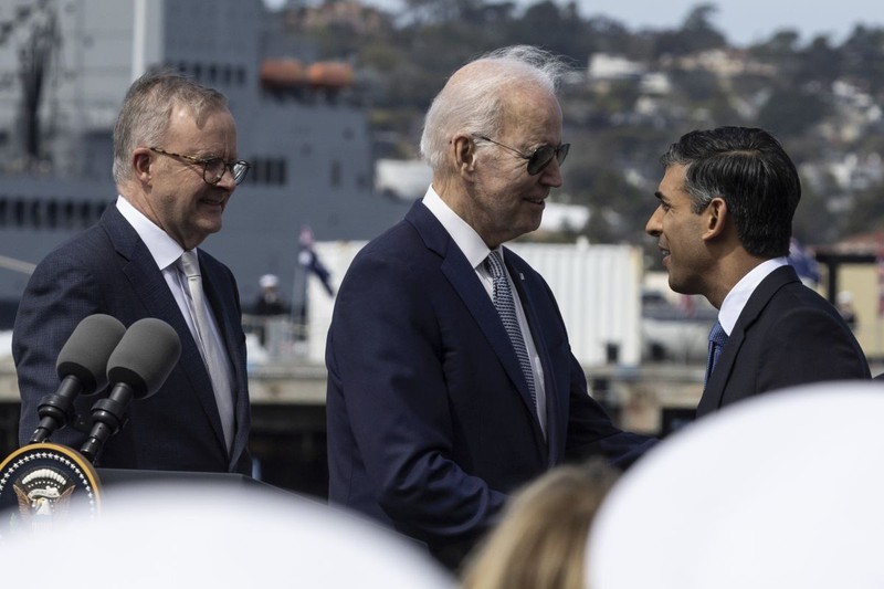 epa10521449 US President Joe Biden (C) shakes hands with British Prime Minister Rishi Sunak (R) as Australian Prime Minister Anthony Albanese (L) looks on following a press conference at the Naval Base Point Miramar in San Diego, California, USA, 13 March 2023. The three leaders announced that Australia will purchase nuclear-powered attack submarines from the U.S. EPA-EFE/ETIENNE LAURENT