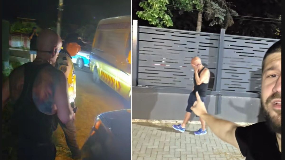 Bogdan Petre, îmbrăcat într-un maiou negru și pantaloni scurți escortat de un polițist îmbrăcat în uniformă de vară cu cămașă cu mânecă scurtă, în apropierea unei dube de intervenție și o mașină de poliție marca Dacia Logan cu autocolantul specific amplasat pe capotă și uși