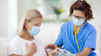 Doctor,Examining,Sick,Patient,In,Face,Mask.,Ill,Woman,In