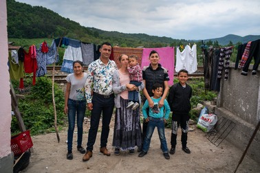 The Mutu's posing for The New York Times, when they crammed in a small, pink house, together with another family | Photo: NYT