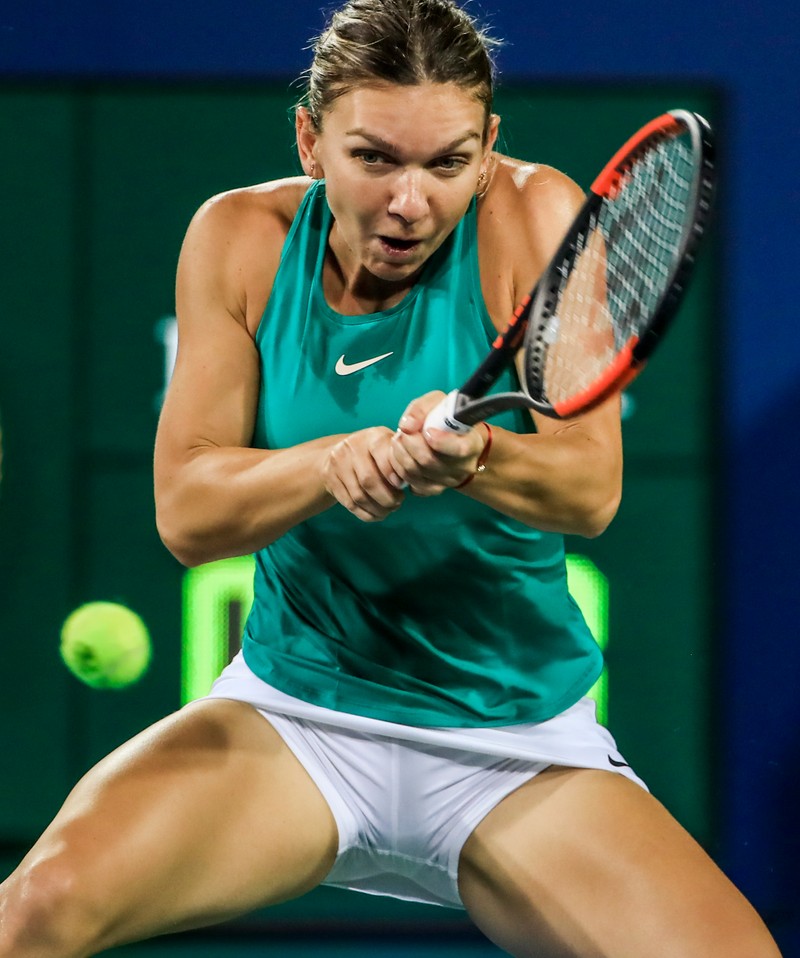 epa06952011 Simona Halep of Romania in action against Ajla Tomljanovic of Australia during their match in the Western &amp; Southern Open tennis tournament at the Lindner Family Tennis Center in Mason, Ohio, USA, 15 August 2018. EPA-EFE/TANNEN MAURY