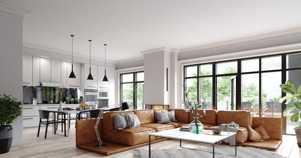 Living open space combinat cu bucatarie, spatios si modern. In fata este o masuta de cafea cu piciare subtiri pe care se afla o vaza cu flori si este pusa pe un covor crem cu ciucuri la capete. In spatele masutei este un divan mare, caramiziu, iar in spate se afla o masa si mobila de bucatarie