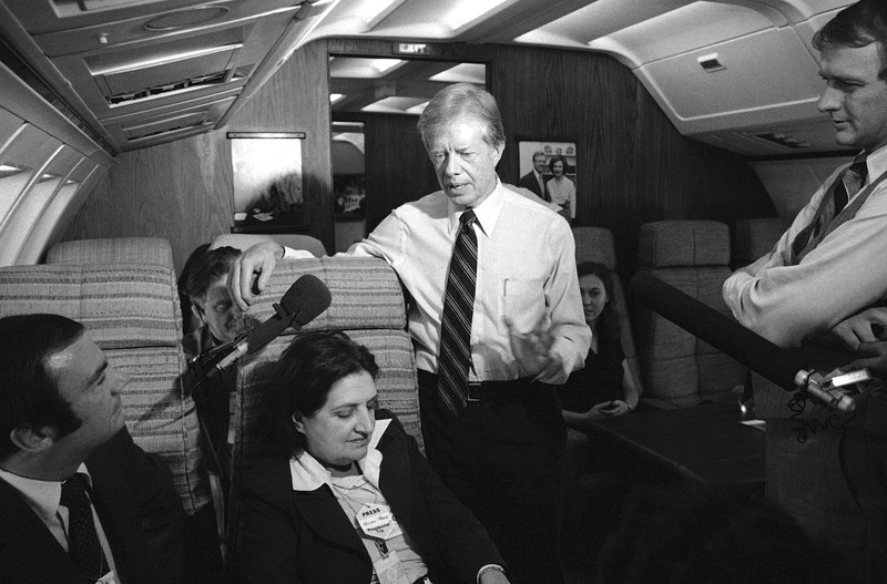 President Jimmy Carter and press secretary Jody Powell, right, talk with reporters Helen Thomas, center, and Sam Donaldson, left, while aboard Air Force One on Oct. 20, 1979 prior to landing at Andrews Air Force Base, Md.,Image: 972031972, License: Rights-managed, Restrictions: This content is intended for editorial use only. For other uses, additional clearances may be required., Model Release: no, Pictured: Helen Thomas,Jimmy Carter,Jody Powell,Sam Donaldson