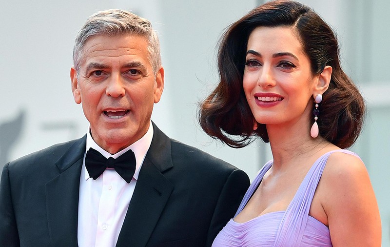 George Clooney și soția lui, Amal, ar putea fi nașii de botez al cuplului regal Harry și Meghan. Cum s-a aflat totul