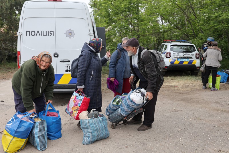 KHARKIV REGION, UKRAINE - MAY 17, 2024 - Elderly people are seen with their belongings during the evacuation from Vovchansk which is under constant Russian shelling, Kharkiv region, northeastern Ukraine.,,Image: 873977092, License: Rights-managed, Restrictions: Restrictions: This photo cannot be distributed in the Russian Federation., Model Release: no