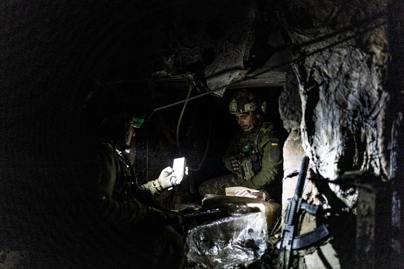 DONETSK OBLAST, UKRAINE - APRIL 11: Ukrainian soldier walks through a burning building after shelling in the direction of Bakhmut frontline as intense military mobility continues amid Russia-Ukraine war on April 11, 2023. Diego Herrera Carcedo / Anadolu Agency/ABACAPRESS.COM,Image: 769062834, License: Rights-managed, Restrictions: , Model Release: no