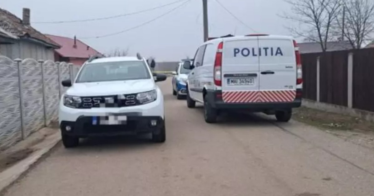 Mașini de poliție, parcate pe o stradă