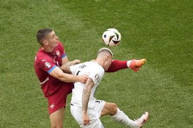 Serbia's Nikola Milenkovic fights for the ball with Slovenia's Benjamin Sesko, right, during a Group C match between Slovenia and Serbia at the Euro 2024 soccer tournament in Munich, Germany, Thursday, June 20, 2024.,Image: 883284328, License: Rights-managed, Restrictions: This content is intended for editorial use only. For other uses, additional clearances may be required., Model Release: no, Pictured: Benjamin Sesko,Nikola Milenkovic