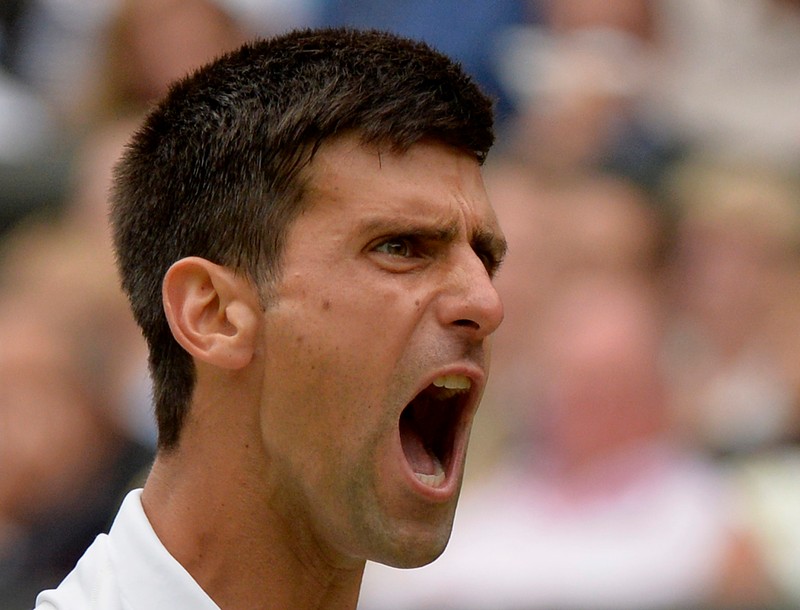 epa04844258 Novak Djokovic of Serbia in action against Roger Federer of Switzerland during their final match for the Wimbledon Championships at the All England Lawn Tennis Club, in London, Britain, 12 July 2015. EPA/ANDY RAIN EDITORIAL USE ONLY/NO COMMERCIAL SALES