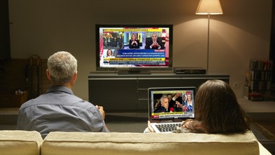 Mid,Adults,Watching,Tv,And,Pc,Thanks,To,Internet,Possibilities