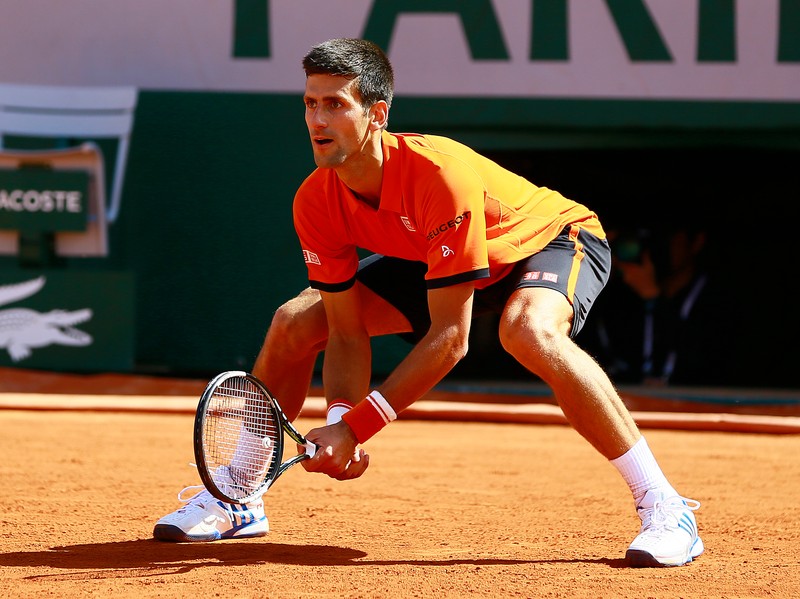 epa04781783 Novak Djokovic of Serbia in action against Rafael Nadal of Spain during their quarterfinal match for the French Open tennis tournament at Roland Garros in Paris, France, 03 June 2015. EPA/ROBERT GHEMENT