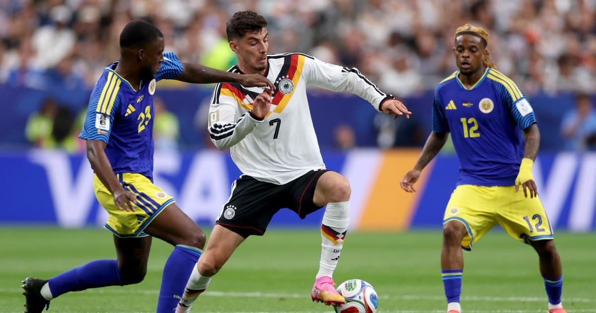 HOUSTON, TEXAS - JUNE 14: Riechedly Bazoer #23 of Curacao challenges Kai Havertz #7 of Germany during the FIFA World Cup 2026 Group E match between Germany and Curacao at Houston Stadium on June 14, 2026 in Houston, Texas. (Photo by Lars Baron/Getty Images)
