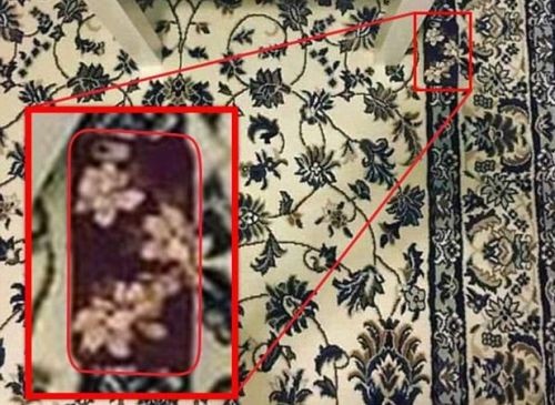 Find the mobile phone on the carpet