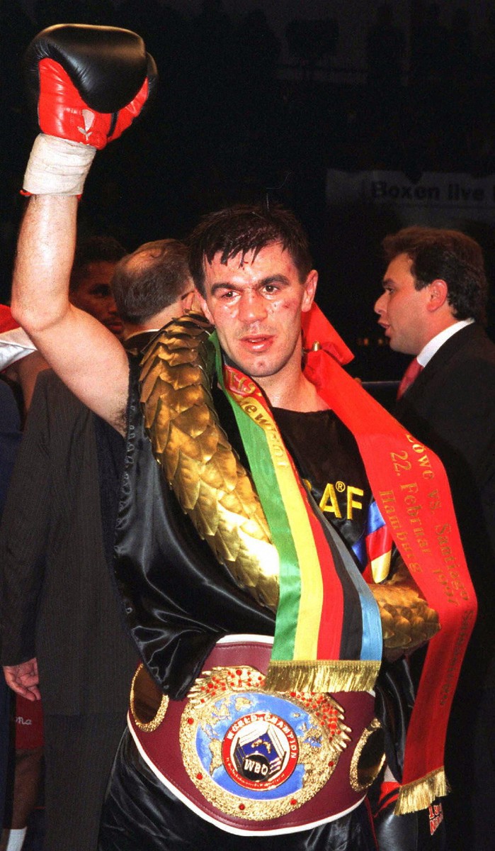 German Rumanian-born Michael Loewe (Mihai Leu) raises his hand in victory while carrying the belt of the new WBO welterweight world boxing champion here late 2 February. The 27-year-old Michael Loewe beat Panamian Santiago Samaniego in his 27th professional bout with points. Loewe has not lost any of his professional 27 fights.,Image: 68534911, License: Rights-managed, Restrictions: , Model Release: no