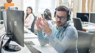 Young,Handsome,Male,Technical,Support,Agent,Trying,To,Explain,Something