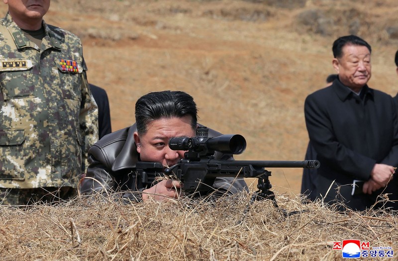 This picture taken on April 4, 2025 and released from North Korea's official Korean Central News Agency (KCNA) via KNS on April 5, 2025 shows North Korea's leader Kim Jong Un (C) looking through a rifle scope as he visits a training base of the Korean People's Army's special operations forces to observe a comprehensive training session, at an undisclosed location in North Korea.,Image: 983675328, License: Rights-managed, Restrictions: South Korea OUT / REPUBLIC OF KOREA OUT ---EDITORS NOTE--- RESTRICTED TO EDITORIAL USE - MANDATORY CREDIT "AFP PHOTO/KCNA VIA KNS" - NO MARKETING NO ADVERTISING CAMPAIGNS - DISTRIBUTED AS A SERVICE TO CLIENTS / THIS PICTURE WAS MADE AVAILABLE BY A THIRD PARTY. AFP CAN NOT INDEPENDENTLY VERIFY THE AUTHENTICITY, LOCATION, DATE AND CONTENT OF THIS IMAGE ---, *** HANDOUT image or SOCIAL MEDIA IMAGE or FILMSTILL for EDITORIAL USE ONLY! * Please note: Fees charged by Profimedia are for the Profimedia's services only, and do not, nor are they intended to, convey to the user any ownership of Copyright or License in the material. Profimedia does not claim any ownership including but not limited to Copyright or License in the attached material. By publishing this material you (the user) expressly agree to indemnify and to hold Profimedia and its directors, shareholders and employees harmless from any loss, claims, damages, demands, expenses (including legal fees), or any causes of action or allegation against Profimedia arising out of or connected in any way with publication of the material. Profimedia does not claim any copyright or license in the attached materials. Any downloading fees charged by Profimedia are for Profimedia's services only. * Handling Fee Only ***, Model Release: no