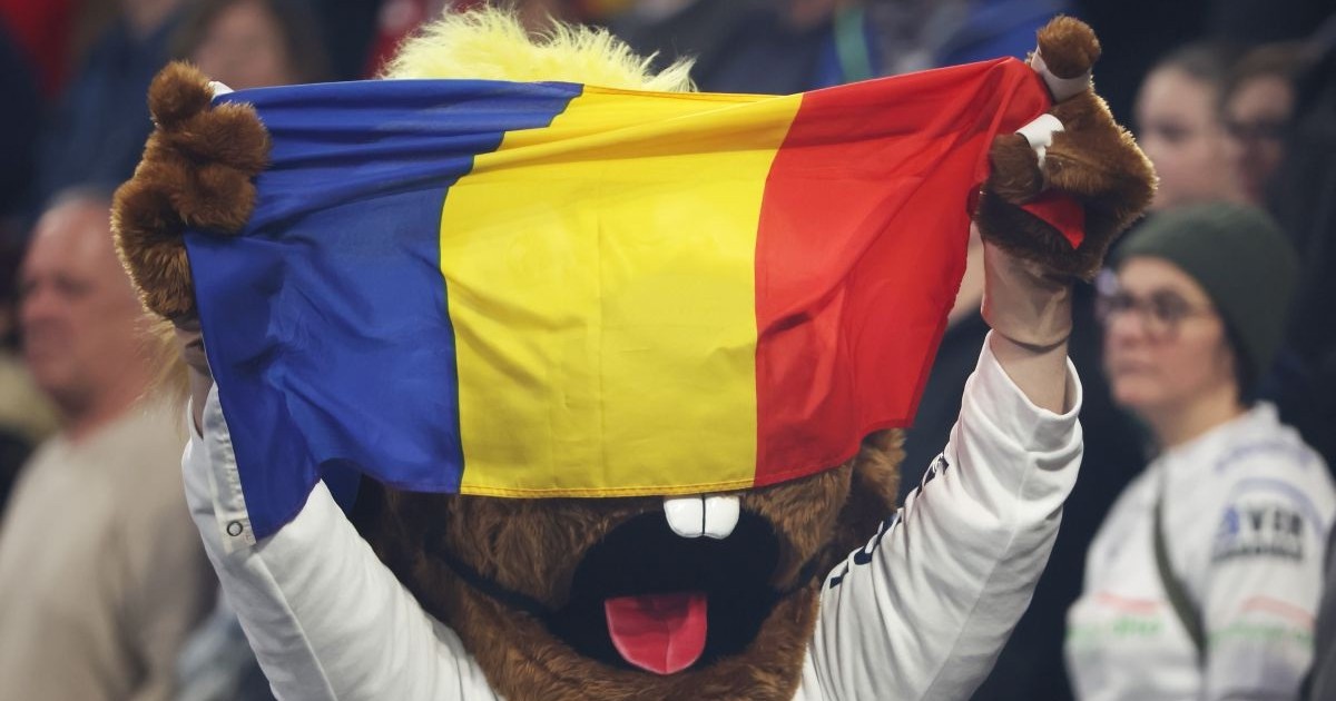 MANNHEIM, GERMANY - JANUARY 14: Mascot Hanniball carries a Romanian flag prior to during the Men's EHF Euro 2024 preliminary round match between Romania and Spain at SAP Arena on January 14, 2024 in Mannheim, Germany. (Photo by Alex Grimm/Getty Images)