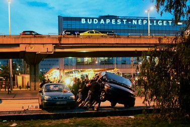epa04913468 Hungarian soccer fans upset a car outside the Groupama Arena, Budapest, Hungary, 04 September 2015, prior to the UEFA Euro 2016 qualifying Group F soccer match between Hungary and Romania. EPA/JANOS MARJAI HUNGARY OUT