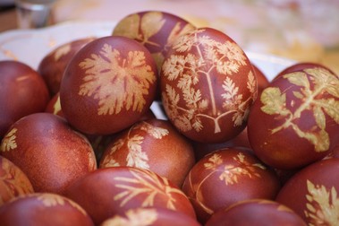 Easter eggs with leaf patterns on table