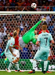 epa05393146 Hungary's goalkeeper Gabor Kiraly (back) in action during the UEFA EURO 2016 round of 16 match between Hungary and Belgium at Stade Municipal in Toulouse, France, 26 June 2016. (RESTRICTIONS APPLY: For editorial news reporting purposes only. Not used for commercial or marketing purposes without prior written approval of UEFA. Images must appear as still images and must not emulate match action video footage. Photographs published in online publications (whether via the Internet or otherwise) shall have an interval of at least 20 seconds between the posting.) EPA/RUNGROJ YONGRIT EDITORIAL USE ONLY
