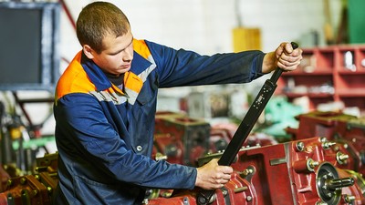 industrial worker assembling the reduction gear box