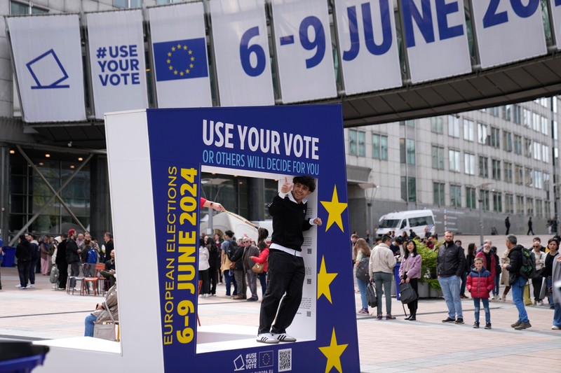 A man poses inside a frame outside the European Parliament during Europe Day celebrations in Brussels on Saturday, May 4, 2024. Europe Day takes place on May 9, just one month away from European elections from June 6-9.,Image: 870163101, License: Rights-managed, Restrictions: This content is intended for editorial use only. For other uses, additional clearances may be required., Model Release: no