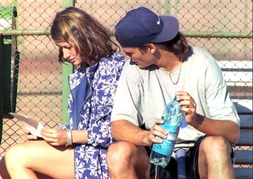 Spanish tennis player Carlos Moya, 20, in idle moments with his Romanian girlfriend Raluca Sandu, 17, daughter of Romanian Soccer Federation President Mircea Sandu, after a training session 10 May. Moya, number seven in the ATP ranking, spends the weekend in Romania.
