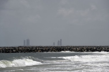 A picture taken on April 29, 2019 shows solitary skyscrapers on the unfinished outline of Eko Atlantic, a planned luxury city built on dredged sand away from 25 metre groynes stretching out into the water from the shore, designed to protect coastal areas such as Alpha Beach, a strip of the Lagos Coastline. Dozens of homes have been destroyed, families displaced, choice property abandoned and once vibrant local economy desvasted as tidal erosion has swept away over 25 meters of land at the Alpha Beach shoreline, once an attractive affluent strip of the Lagos Coastline, Nigeria's commercial nerve centre.,Image: 454886534, License: Rights-managed, Restrictions: TO GO WITH AFP STORY BY EMMANUEL AKINWOTU, Model Release: no, Credit line: Profimedia
